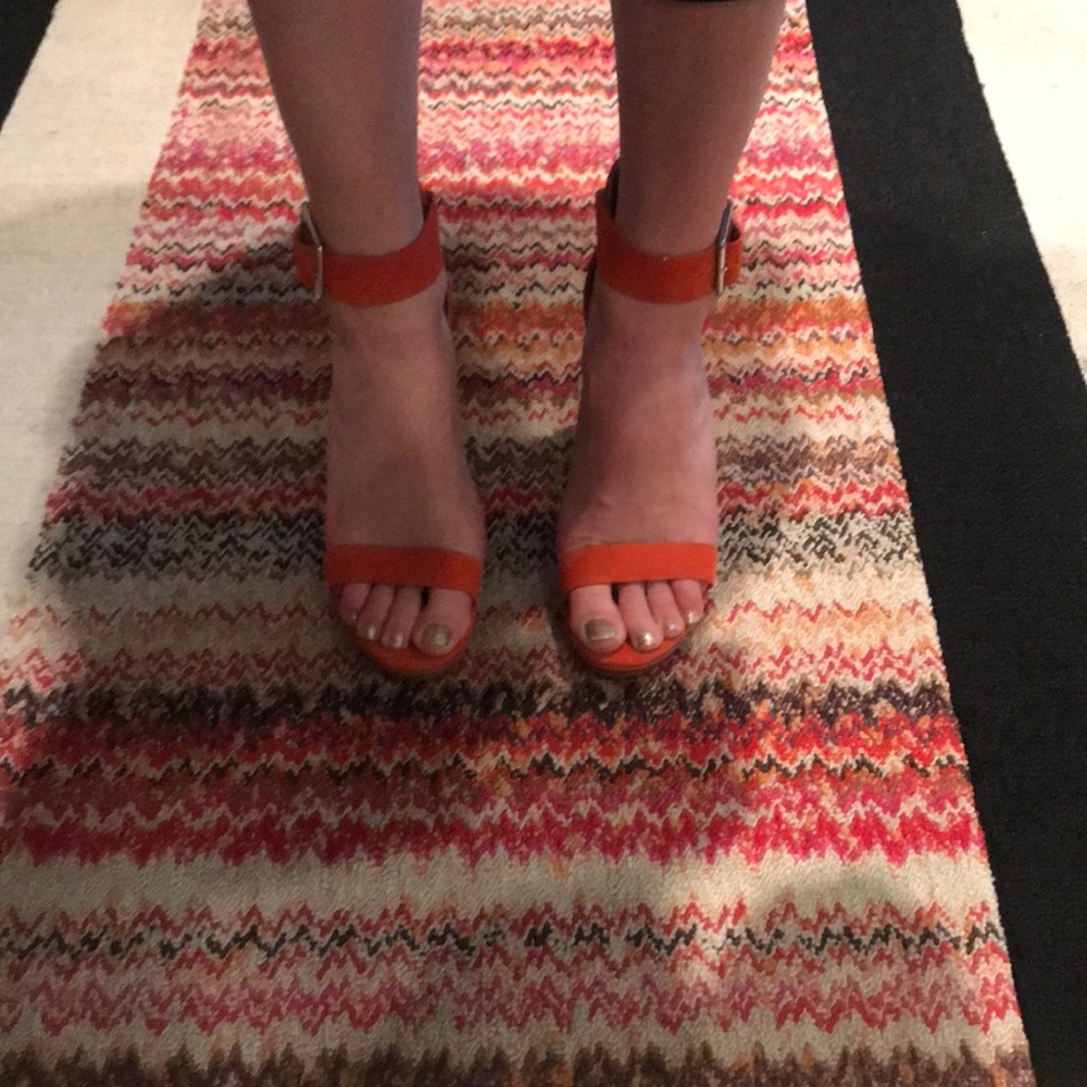 Orange Calvin Klein platform sandal heels.